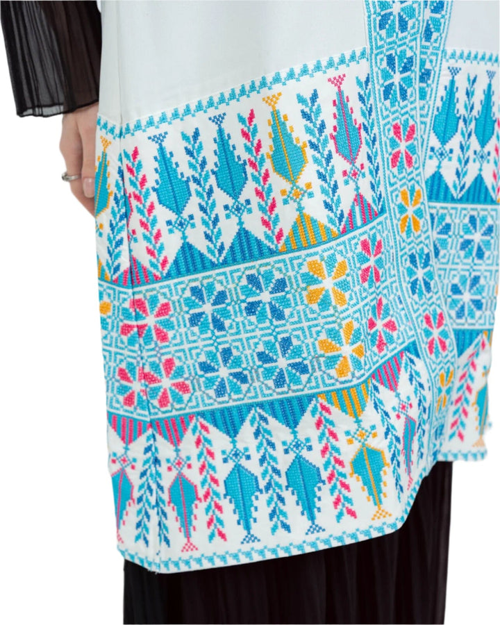 - This Traditional Palestinian Embroidered Long Vest Offers Elegance And Style Together. - Colored With The Nobility Of Blue, This Vest Easily Adapts To Any Style. - It Is Made Of High Quality Materials And Offers Maximum Comfort To The User. - It Can Be Easily Preferred Both In Daily Life And On Special Occasions Depending On The Situation - It Draws Attention With Its Elegant Details And Reveals Its Difference. - Thanks To Its Body-Hugging Cut, It Gives You A Nice Look While Not Restricting Your Mobility.