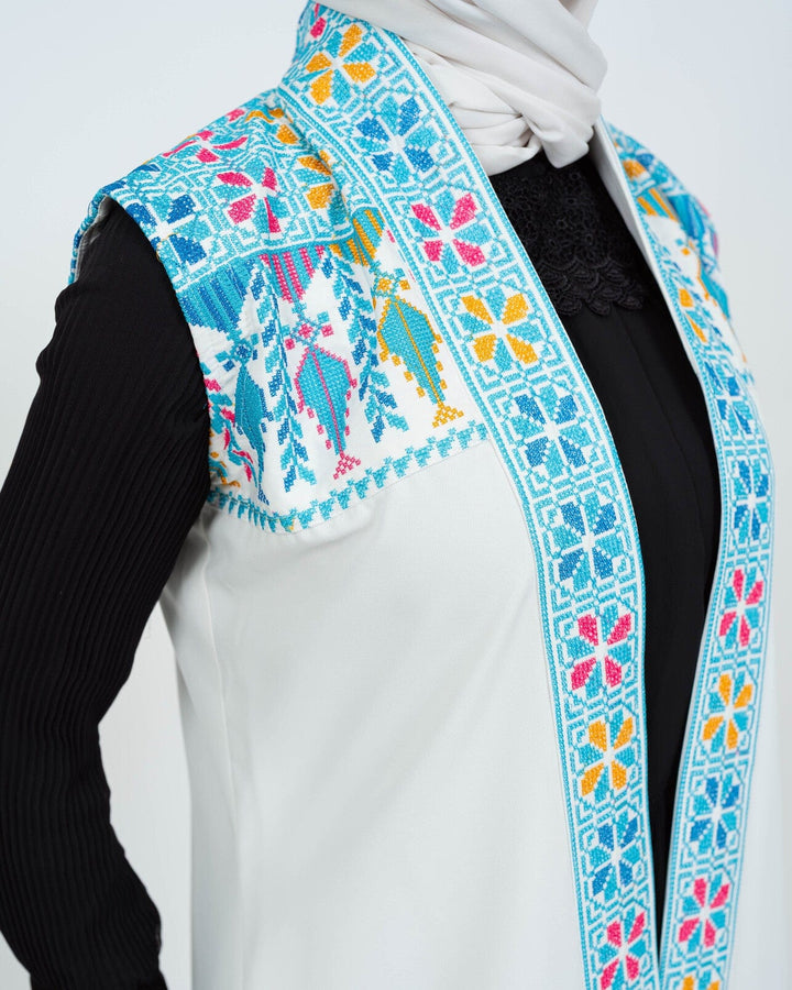 - This Traditional Palestinian Embroidered Long Vest Offers Elegance And Style Together. - Colored With The Nobility Of Blue, This Vest Easily Adapts To Any Style. - It Is Made Of High Quality Materials And Offers Maximum Comfort To The User. - It Can Be Easily Preferred Both In Daily Life And On Special Occasions Depending On The Situation - It Draws Attention With Its Elegant Details And Reveals Its Difference. - Thanks To Its Body-Hugging Cut, It Gives You A Nice Look While Not Restricting Your Mobility.