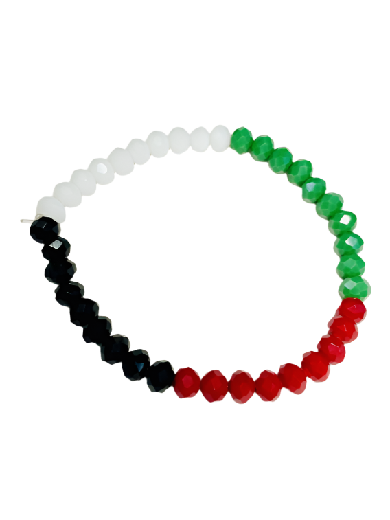 Adorn your wrist with a piece of art that carries the colors of pride and patriotism with this stunning bracelet crafted from shimmering crystal beads. The bracelet shines with the four graduated colors of the Palestinian flag: red, green, white, and black, harmoniously arranged to reflect the beauty of Palestinian identity. Each crystal bead is meticulously polished to catch the light, adding a captivating sparkle to your wrist. This bracelet is more than just an accessory; it is a daily expression of your