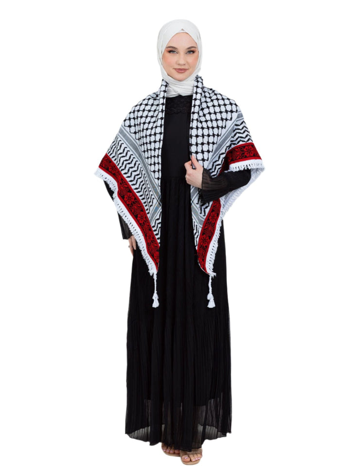 Add a touch of heritage and elegance to your look with this distinctive shawl inspired by the authentic Palestinian Keffiyeh. The shawl features the traditional Keffiyeh pattern, and its beauty is highlighted by intricate hand embroidery in red along the edges