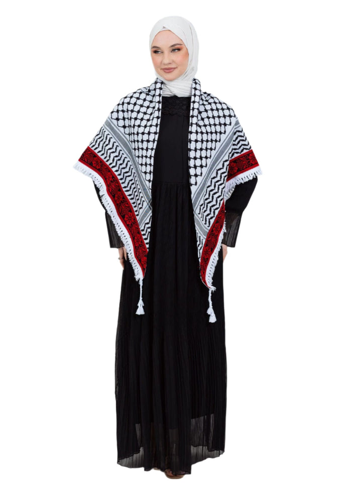 Add a touch of heritage and elegance to your look with this distinctive shawl inspired by the authentic Palestinian Keffiyeh. The shawl features the traditional Keffiyeh pattern, and its beauty is highlighted by intricate hand embroidery in red along the edges