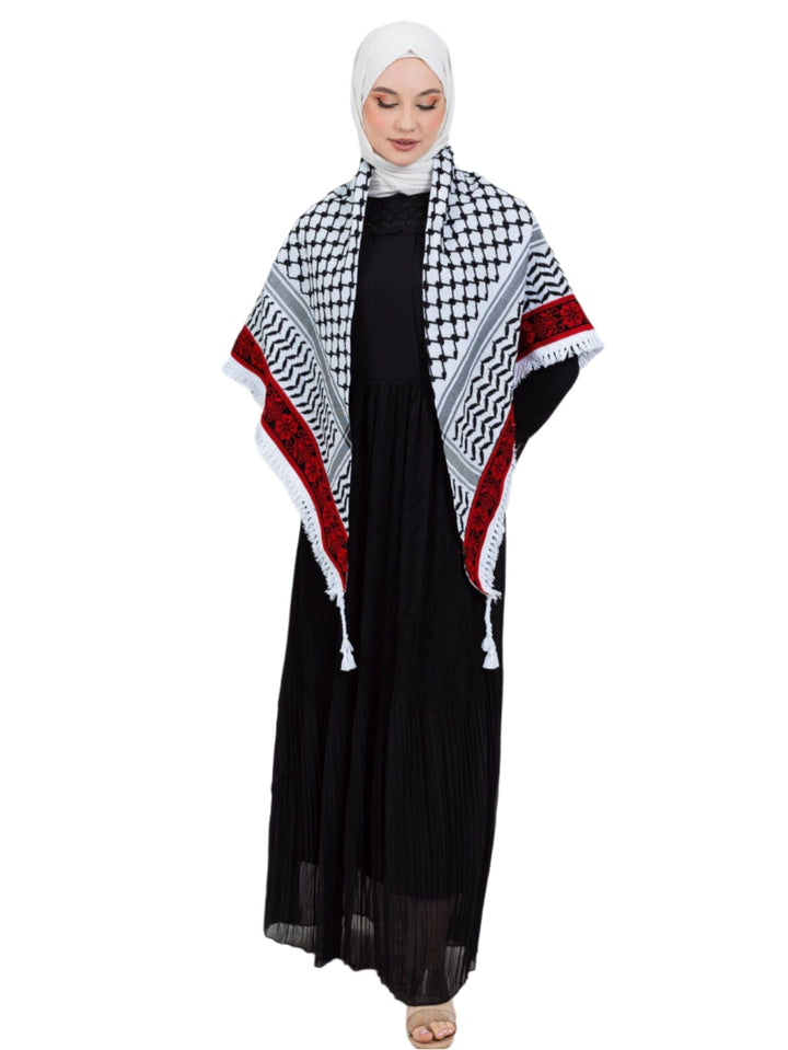 Add a touch of heritage and elegance to your look with this distinctive shawl inspired by the authentic Palestinian Keffiyeh. The shawl features the traditional Keffiyeh pattern, and its beauty is highlighted by intricate hand embroidery in red along the edges