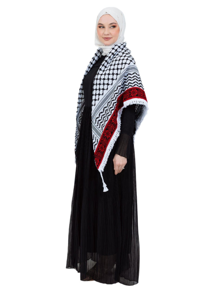 Add a touch of heritage and elegance to your look with this distinctive shawl inspired by the authentic Palestinian Keffiyeh. The shawl features the traditional Keffiyeh pattern, and its beauty is highlighted by intricate hand embroidery in red along the edges