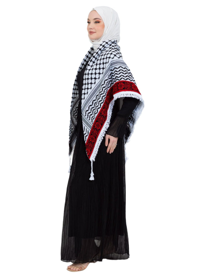 Add a touch of heritage and elegance to your look with this distinctive shawl inspired by the authentic Palestinian Keffiyeh. The shawl features the traditional Keffiyeh pattern, and its beauty is highlighted by intricate hand embroidery in red along the edges