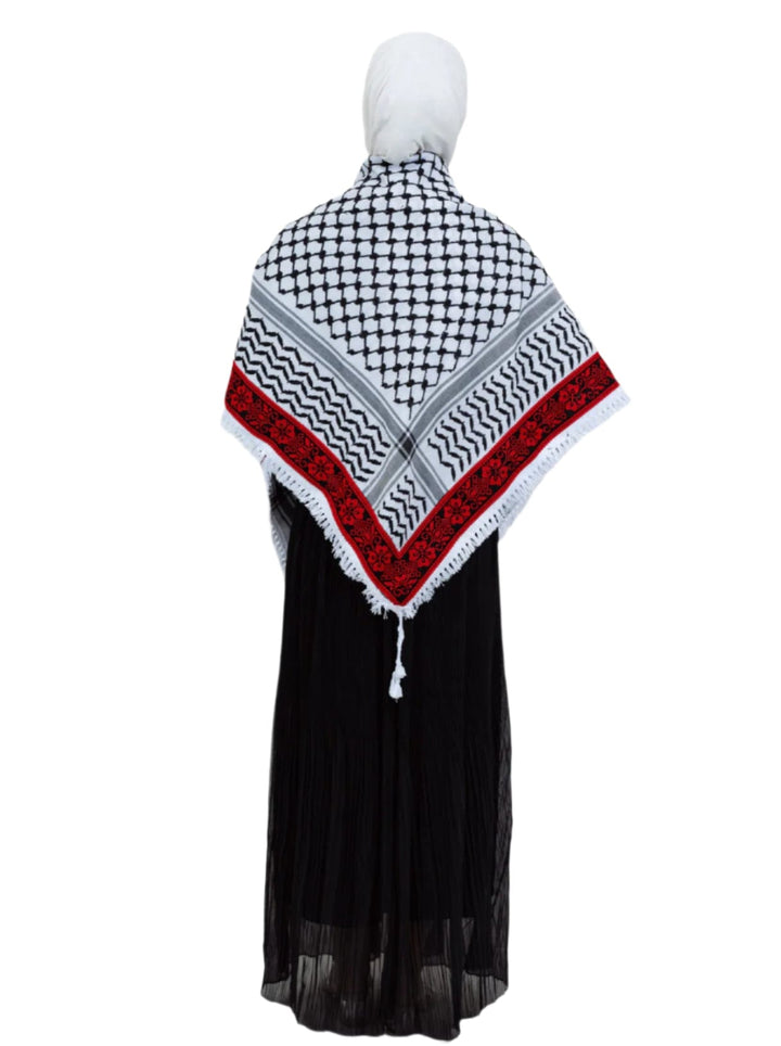 Add a touch of heritage and elegance to your look with this distinctive shawl inspired by the authentic Palestinian Keffiyeh. The shawl features the traditional Keffiyeh pattern, and its beauty is highlighted by intricate hand embroidery in red along the edges
