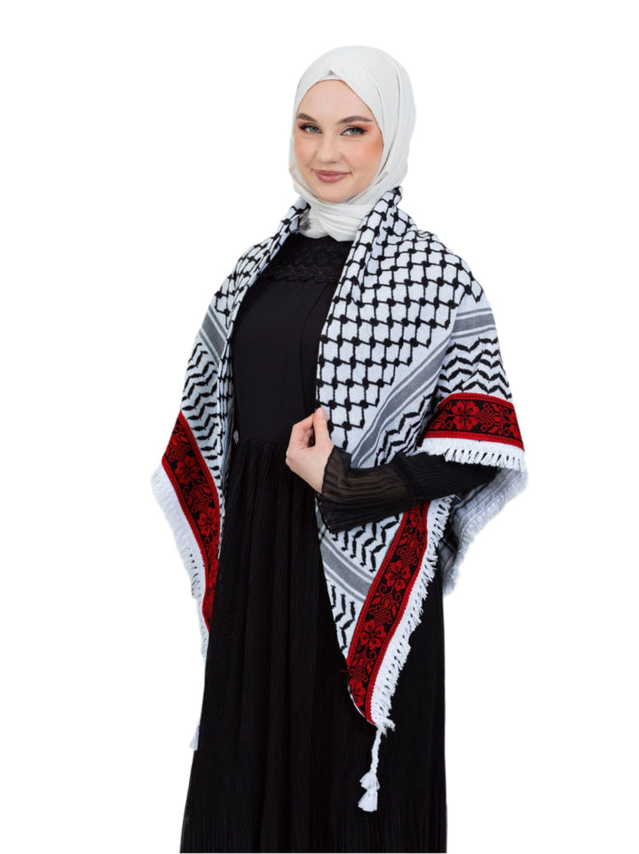Add a touch of heritage and elegance to your look with this distinctive shawl inspired by the authentic Palestinian Keffiyeh. The shawl features the traditional Keffiyeh pattern, and its beauty is highlighted by intricate hand embroidery in red along the edges