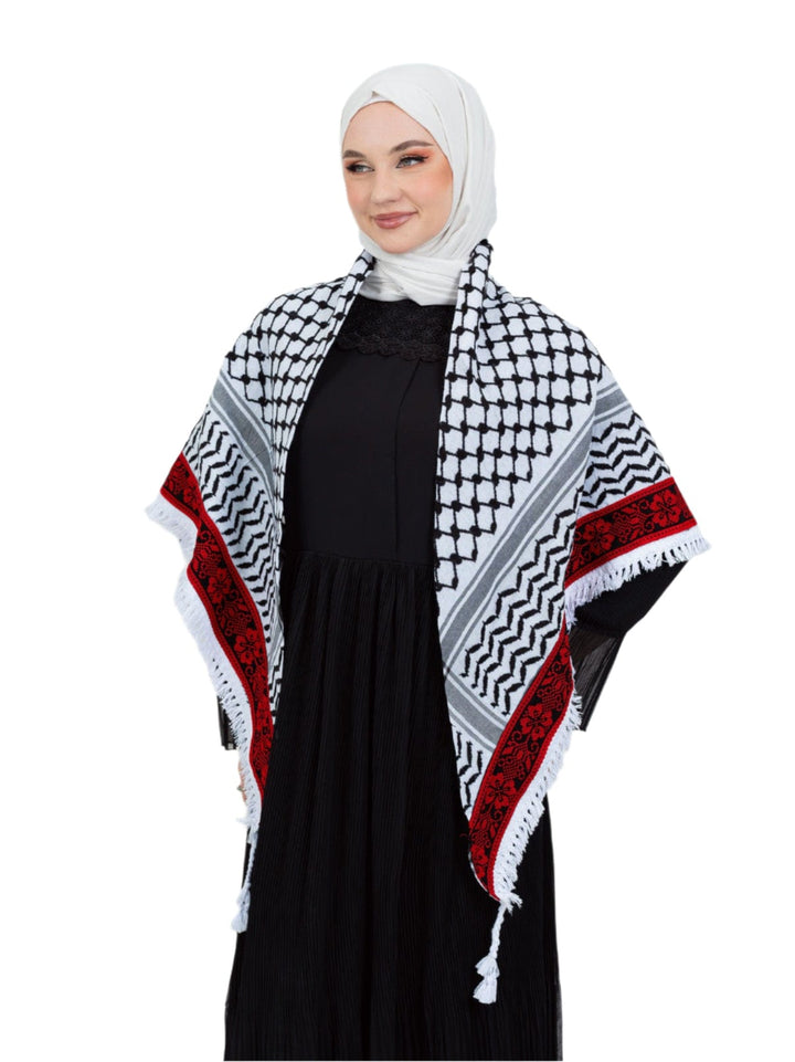 Add a touch of heritage and elegance to your look with this distinctive shawl inspired by the authentic Palestinian Keffiyeh. The shawl features the traditional Keffiyeh pattern, and its beauty is highlighted by intricate hand embroidery in red along the edges