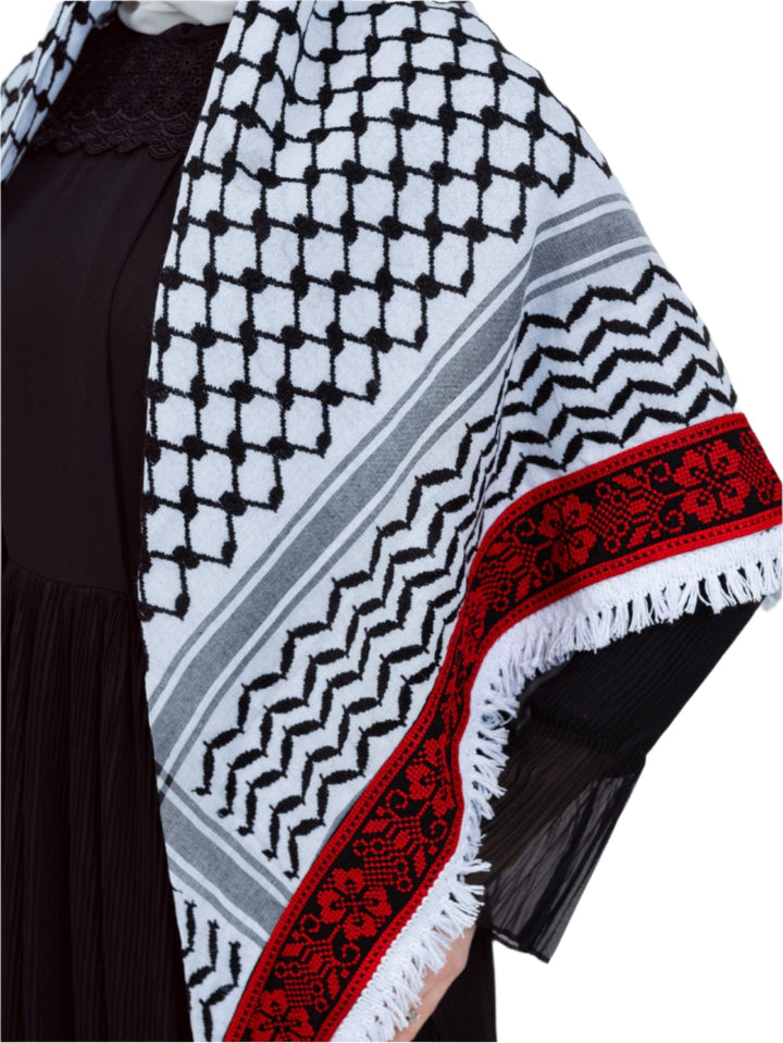 Add a touch of heritage and elegance to your look with this distinctive shawl inspired by the authentic Palestinian Keffiyeh. The shawl features the traditional Keffiyeh pattern, and its beauty is highlighted by intricate hand embroidery in red along the edges