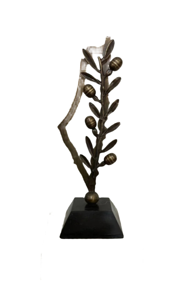 This piece beautifully embodies the essence of Palestinian heritage. At its heart, the design features a representation of the map of Palestine, upon which rests an elegant olive branch, its delicate leaves and plump olives meticulously crafted.

The olive branch evokes a distinct sense of connection to the land and hope for its return to its rightful owners.

The entire sculpture is mounted on a solid black marble base, providing a sense of permanence and strength. The contrast between the rich green hues 