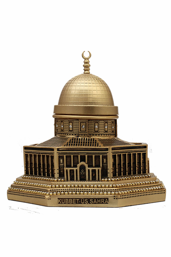 A gold-colored decorative figurine representing the Dome of the Rock with intricate architectural details and a dome on top.