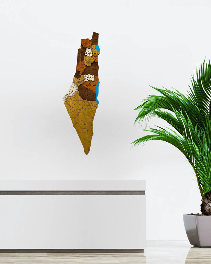 Decorative wall art of a stylized map on a white wall with a plant in the foreground.