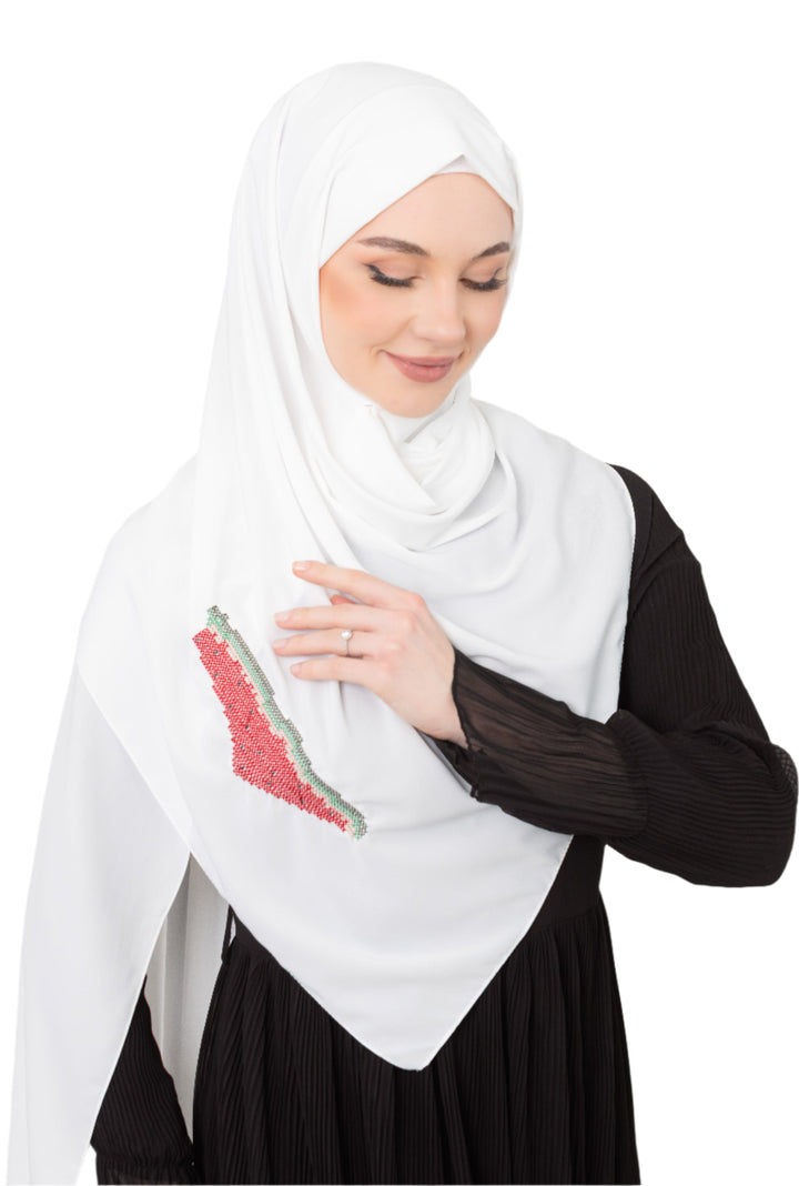 An elegant light grey Shawl&nbsp;, made from high-quality polyester and measuring 70 x 180 cm. It features unique and beautiful embroidery of the map of Palestine, in colors inspired by the watermelon (red, green, black, and white), which has be