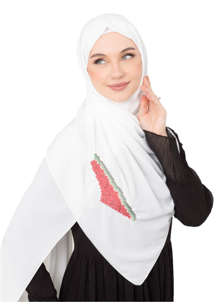 An elegant light grey Shawl&nbsp;, made from high-quality polyester and measuring 70 x 180 cm. It features unique and beautiful embroidery of the map of Palestine, in colors inspired by the watermelon (red, green, black, and white), which has be