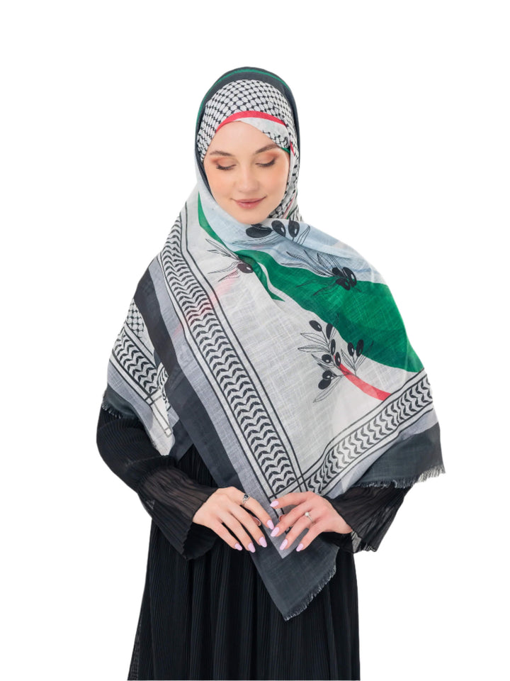 Elevate your look with this exquisite scarf crafted from the finest polyester, draping softly to offer a feeling of comfort and luxury. Measuring a perfect 70 x 180 cm, this scarf boasts a unique design that blends elegance with simplicity. It is beautifully adorned with an artistic print of an olive branch – a timeless symbol of peace, authenticity, and renewal – precisely printed on one side. More than just a piece of fabric, this scarf is an expression of sophisticated taste and a connection to nature an