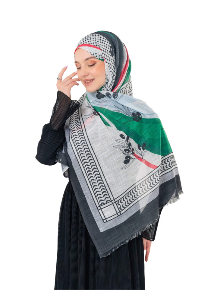 Elevate your look with this exquisite scarf crafted from the finest polyester, draping softly to offer a feeling of comfort and luxury. Measuring a perfect 70 x 180 cm, this scarf boasts a unique design that blends elegance with simplicity. It is beautifully adorned with an artistic print of an olive branch – a timeless symbol of peace, authenticity, and renewal – precisely printed on one side. More than just a piece of fabric, this scarf is an expression of sophisticated taste and a connection to nature an