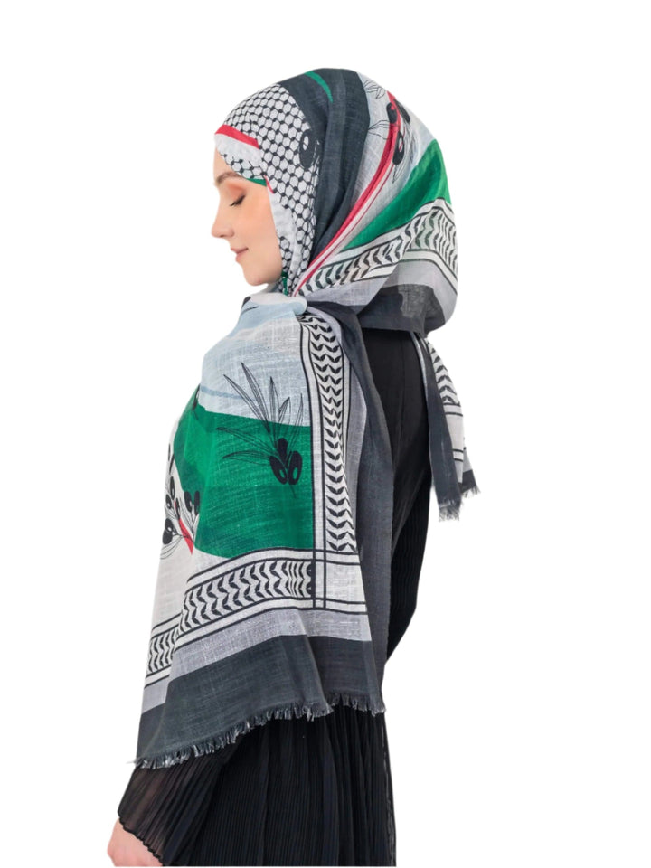 Elevate your look with this exquisite scarf crafted from the finest polyester, draping softly to offer a feeling of comfort and luxury. Measuring a perfect 70 x 180 cm, this scarf boasts a unique design that blends elegance with simplicity. It is beautifully adorned with an artistic print of an olive branch – a timeless symbol of peace, authenticity, and renewal – precisely printed on one side. More than just a piece of fabric, this scarf is an expression of sophisticated taste and a connection to nature an