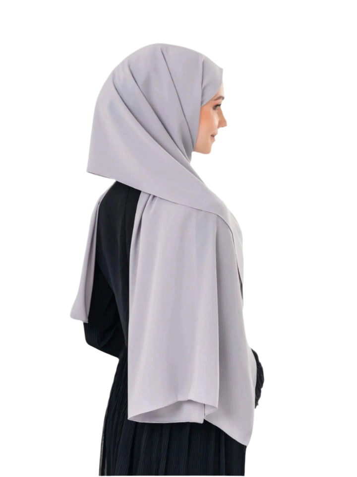 An elegant light grey scarf, made from high-quality polyester and measuring 70 x 180 cm. It features unique and beautiful embroidery of the map of Palestine, in colors inspired by the watermelon (red, green, black, and white), which has become a symbol of resistance and connection to Palestinian identity. This scarf adds a distinctive touch of elegance and deep meaning to your look.