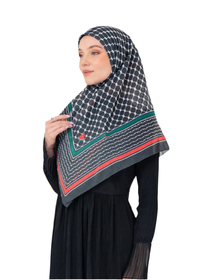 Woman wearing a patterned hijab with a white background