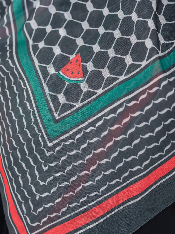 Close-up of a patterned fabric with geometric design and watermelon slice