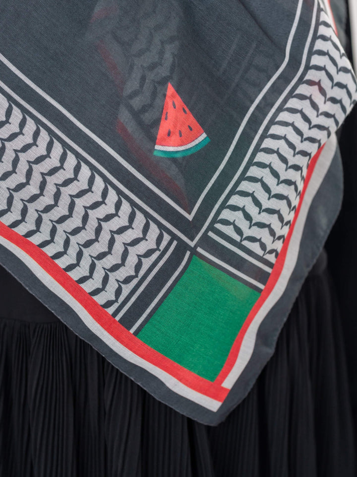 Scarf with watermelon design and geometric pattern on a black background