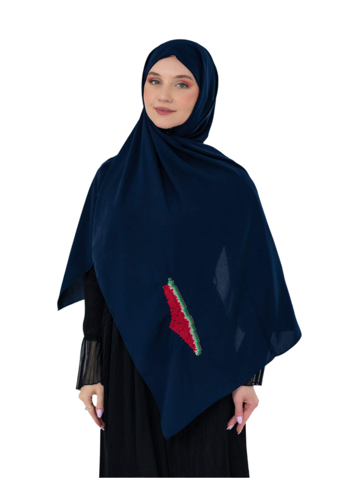 Navy blue hijab with a red and green design worn by a model on a white background
